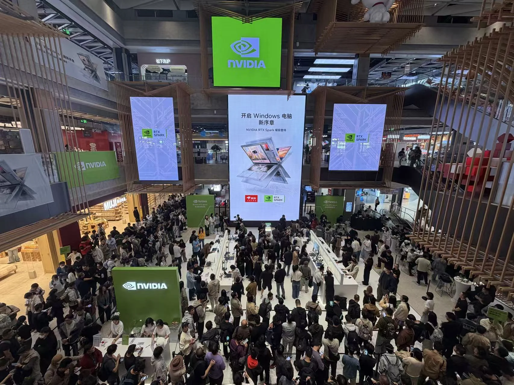 Visitors explore demonstration stations beneath NVIDIA RTX Spark launch signage at the event venue.
